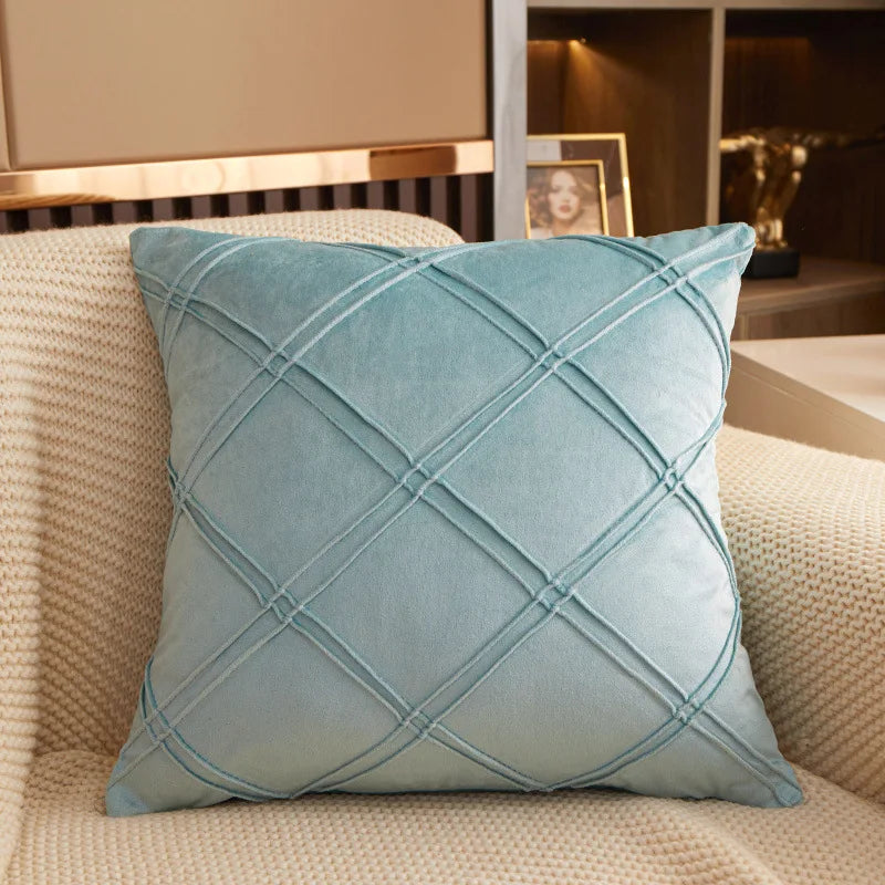 Ice blue brushed velvet geometric cushion cover on a sofa